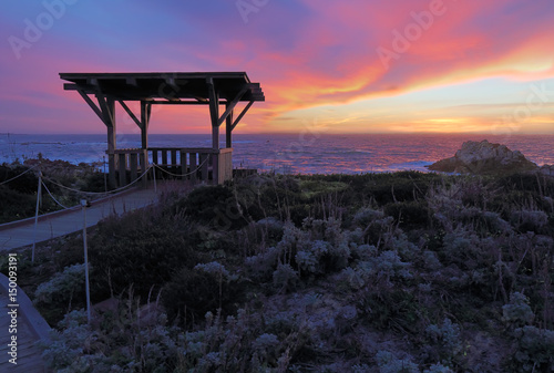 Sunset behind a public gazebo at Asilomar State Beach in California photo