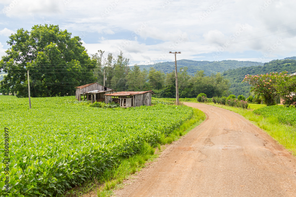 Farm barn in dirt road