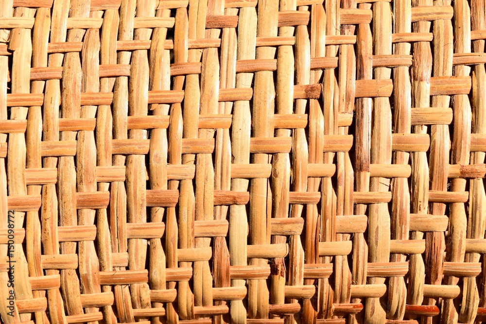 Fototapeta premium Traditional Thailand style pattern nature background of brown handicraft weave texture bamboo surface ,Texture for add text or graphic design