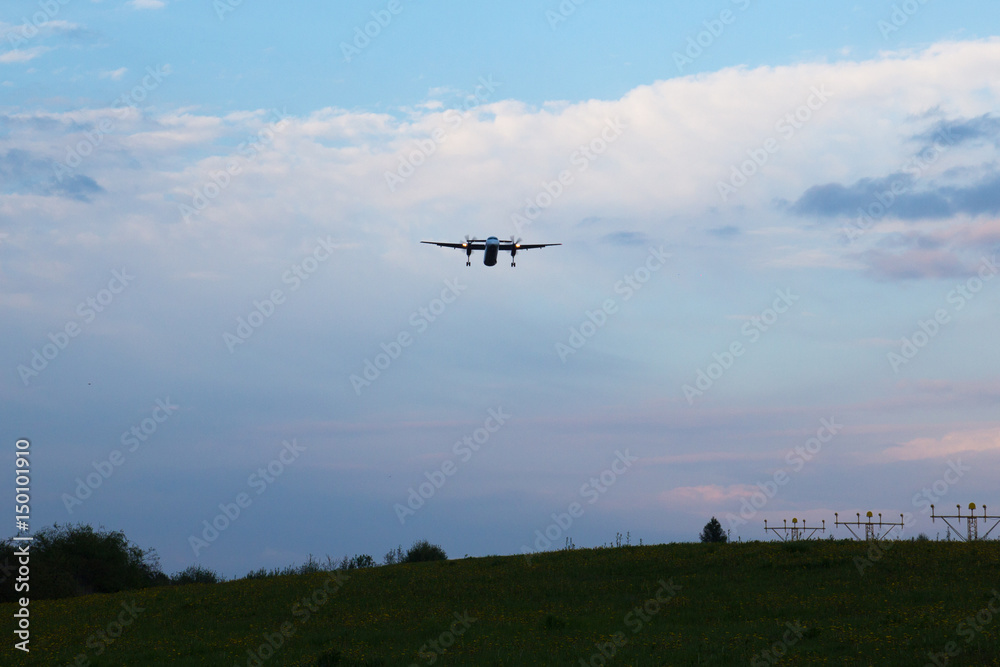 The plane lands at dusk The plane lands at dusk