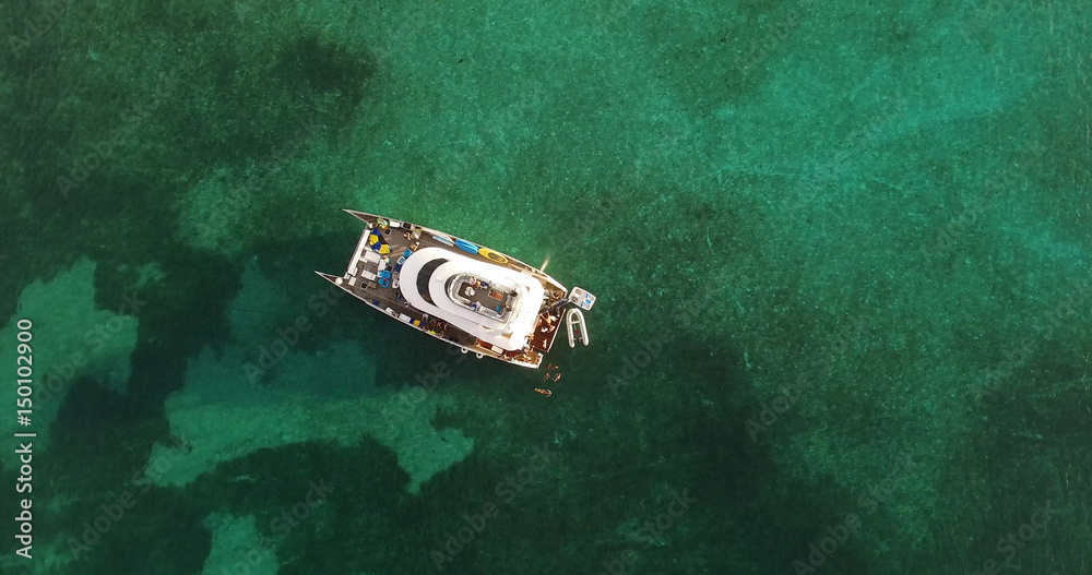 Fototapeta premium Top View of Catamaran on a Coral Reef in Bahamas 