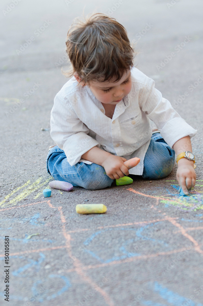 Fototapeta premium Boy chalking hopscotch
