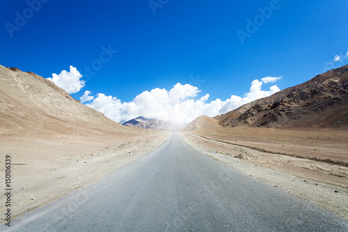 The road cuts through the rocky mountainside Magnetic Hill Road, Leh Ladakh India
