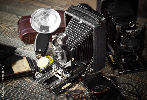 Old camera on an old background on a close-up table