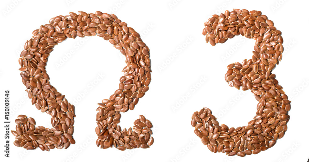 uncooked flax seeds on white uncooked flax seeds on white