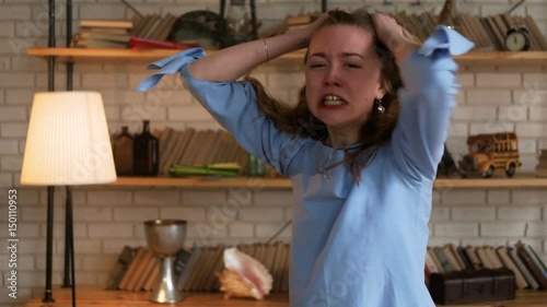 portrait of beautiful blonde angry woman being very unhappy hysterize and shout with tears looking at the camera because of big trouble and stress