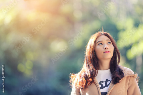 Asian Woman with cherry blossom nature background