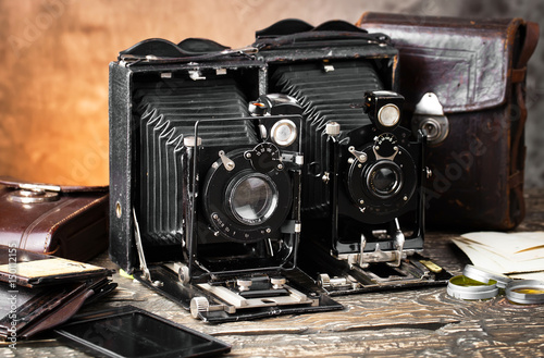 Old camera on an old background on a close-up table