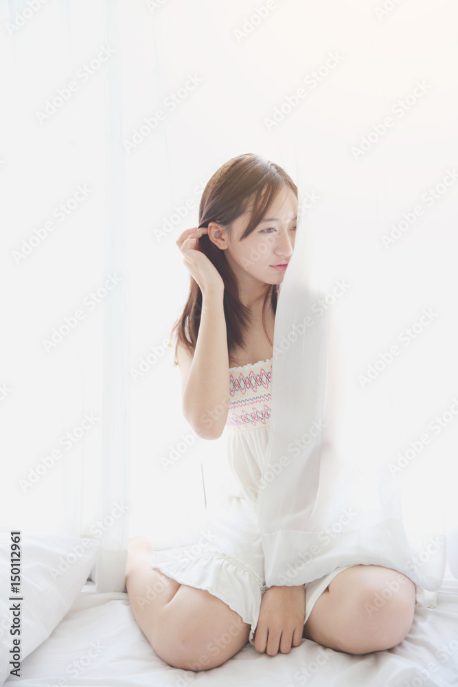 Asian girl wake up in bedroom