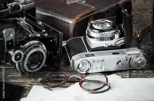 Old camera on an old background on a close-up table