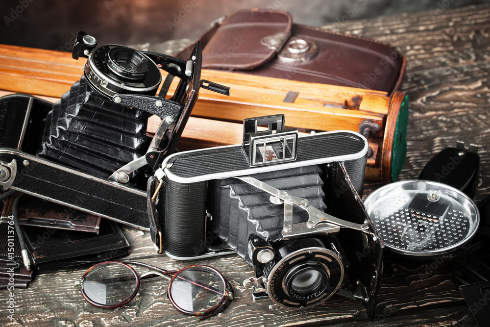 Old camera on an old background on a close-up table