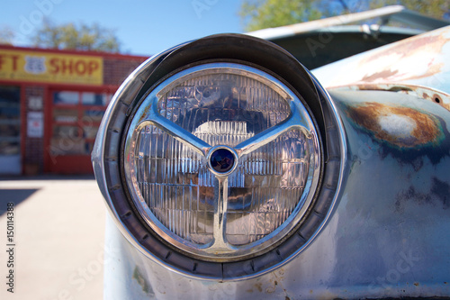 Headlight of an old abandoned automobile in Seligman, Arziona photo