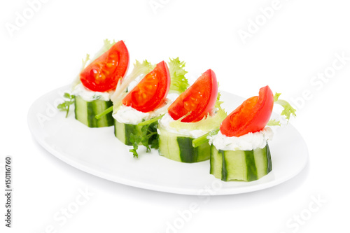 Cucumber Bites with Cream Herb  Cheese and Cherry Tomatoes isolated on white