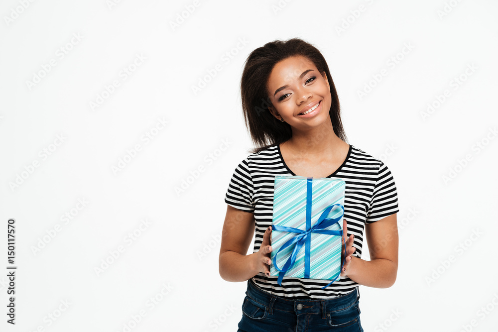 Portrait of a young afro american woman holding present box Portrait of a young afro american woman holding present box