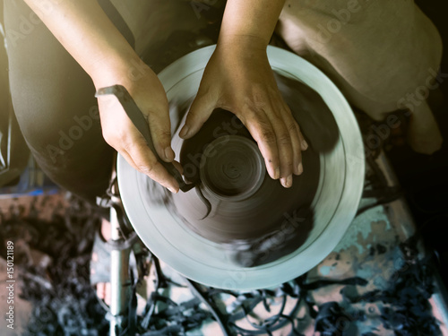 Obraz na płótnie Potter making a clay pot, handmade, selective focus w salonie