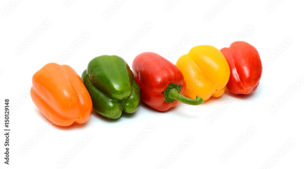 Fresh colorful bell peppers on the white background Fresh colorful bell peppers on the white background