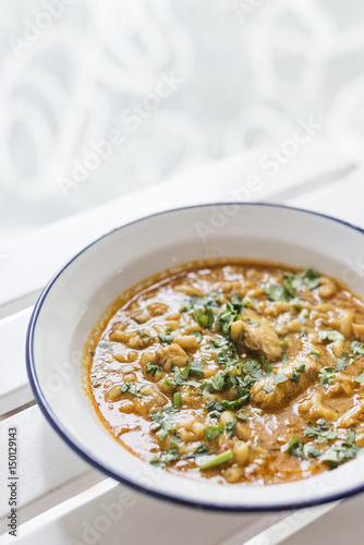 creamy spicy seafood fish soup with coriander