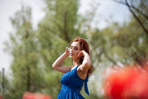 Dreammy romantic woman in outdoor photo in sunny summer day. Beautiful girl in springtime