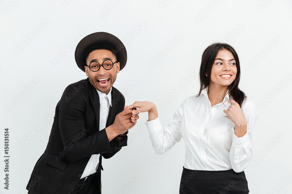 Happy african business man holding hand of his colleague woman Happy african business man holding hand of his colleague woman