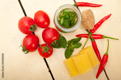 Italian pasta paccheri with tomato mint and chili pepper photo