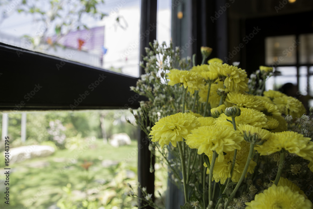 Flowers at the window in the restaurant Flowers at the window in the restaurant