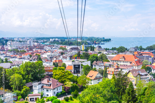 Foto View of a pfanderbahn cable car with the Austrian city Bregenz behind it