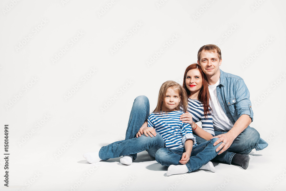 Happy family portrait sitting on white background isolated Happy family portrait sitting on white background isolated