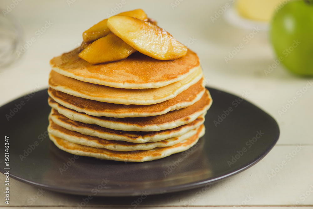 Pancakes with apple on table. Breakfast, snacks. Pancakes Day. Pancakes with apple on table. Breakfast, snacks. Pancakes Day.