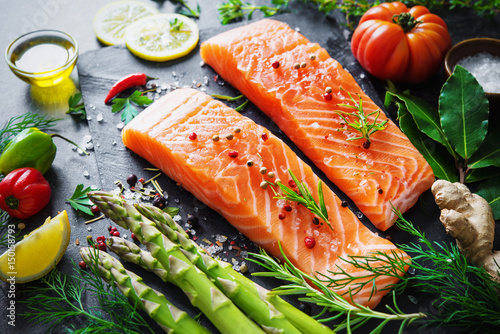 Fototapeta Naklejka Na Ścianę i Meble -  Fresh salmon fillet with aromatic herbs, spices and vegetables