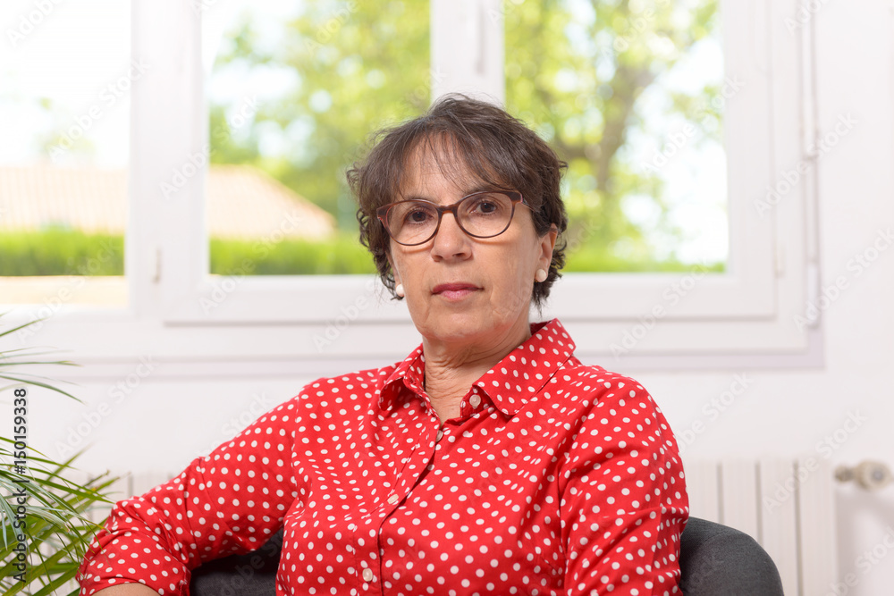 mature woman with a red shirt with white dots mature woman with a red shirt with white dots