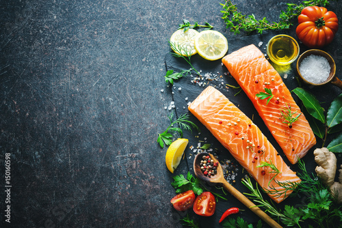 Fototapeta Naklejka Na Ścianę i Meble -  Fresh salmon fillet with aromatic herbs, spices and vegetables