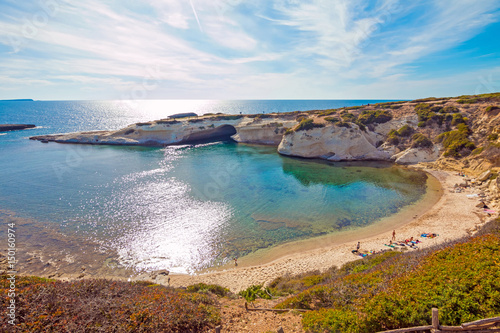 Limestone rock with arch, S`Archittu di Santa Caterina in Oristano Province, Sardinia, Italy photo