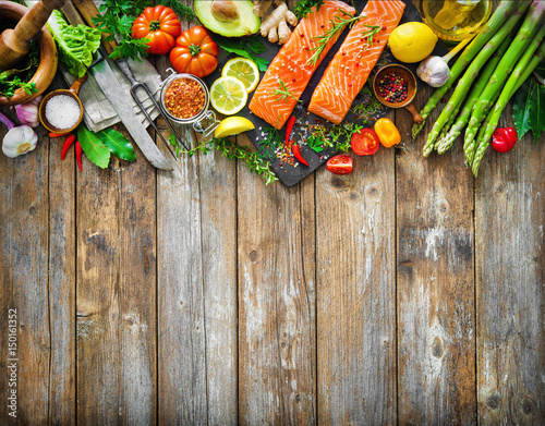 Fototapeta Naklejka Na Ścianę i Meble -  Fresh salmon fillet with aromatic herbs, spices and vegetables
