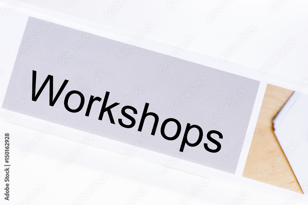 Office folder with the label workshops on white background Office folder with the label workshops on white background