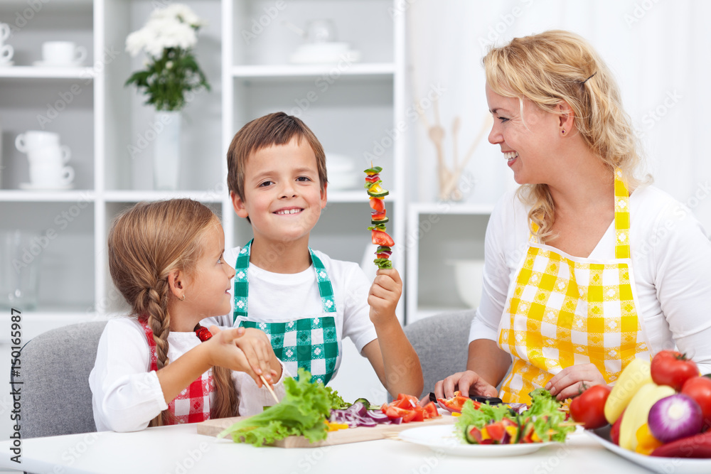Happy young kids preparing a healthy snack