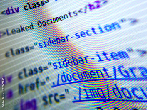 'Leaked documents' - real HTML code on computer screen, stylized, selective focus