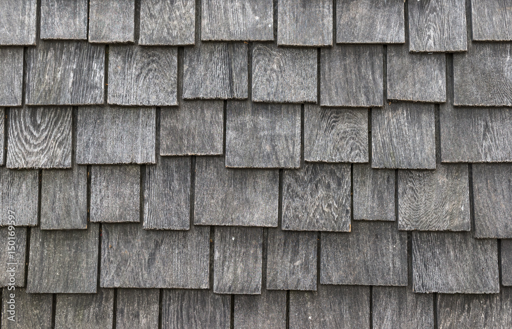 worn and weathered wooden shingles background texture