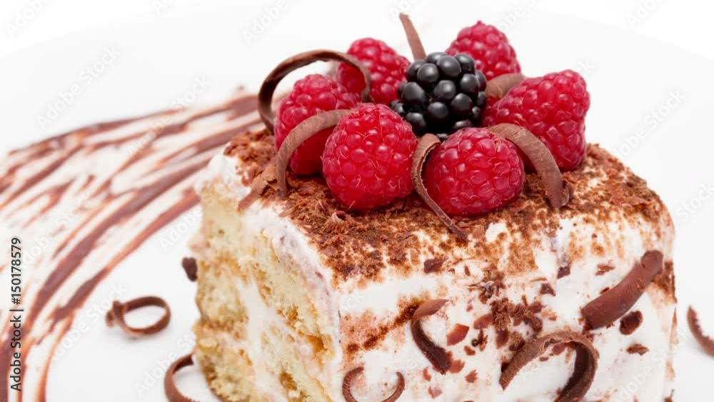 Tiramisu decorated raspberries and blackberries macro zoom out Tiramisu decorated raspberries and blackberries macro zoom out