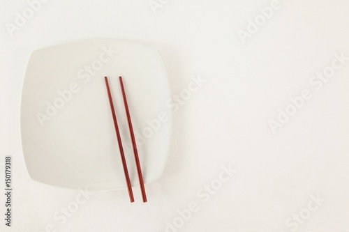 Pair of chopsticks on a plate
