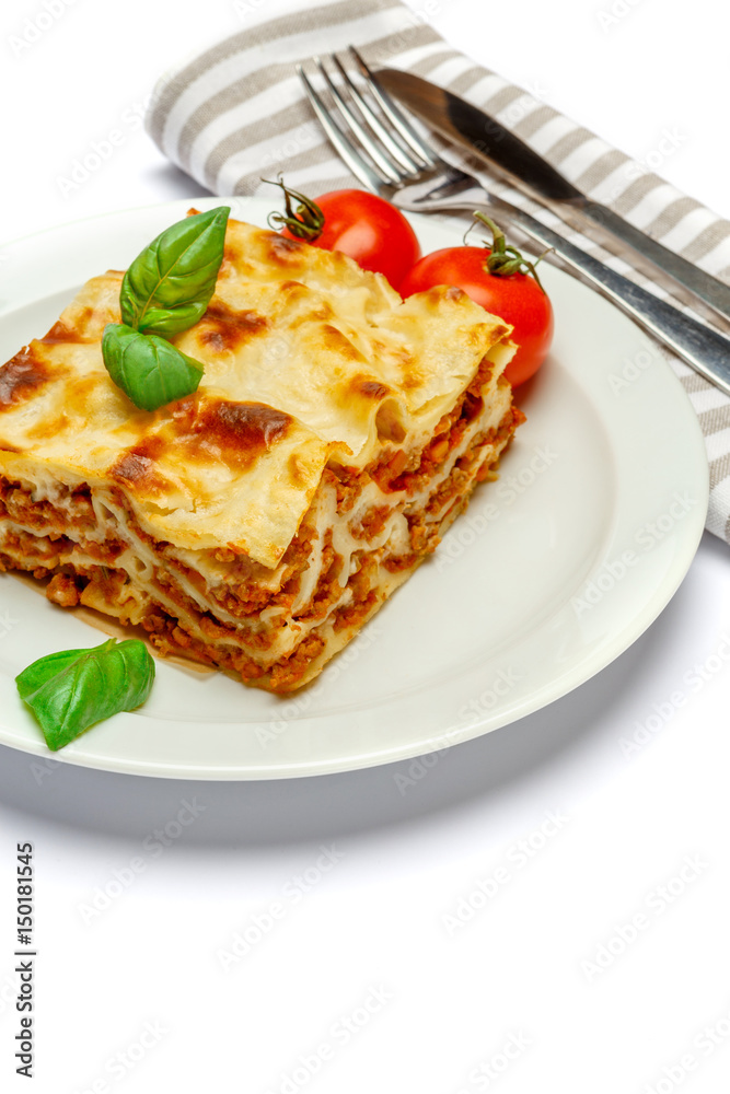 Portion of tasty lasagna isolated on white