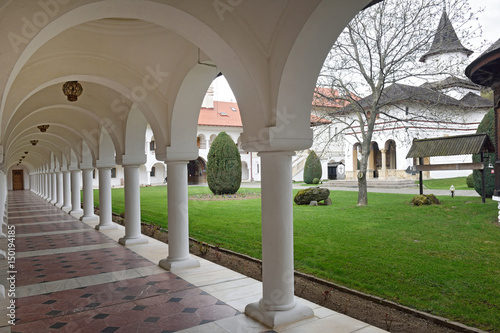 Arched in Sambata de Sus monastery in Transylvania, Romania photo