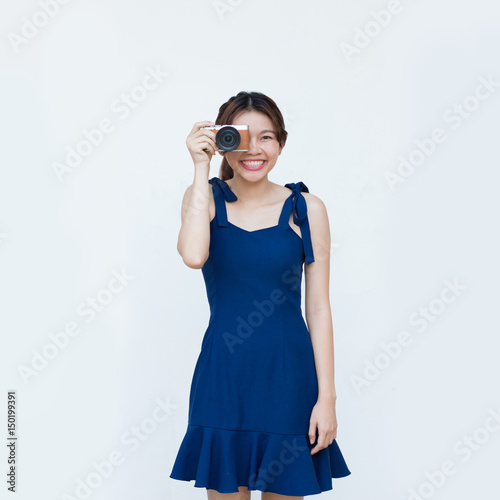 Asian woman using camera with white background © toonzzz