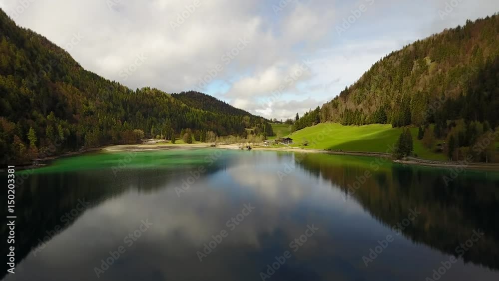 Aerial: flying over Hintersteiner Mountain lake with clear water in Austria and beautiful cloud reflections Aerial: flying over Hintersteiner Mountain lake with clear water in Austria and beautiful cloud reflections