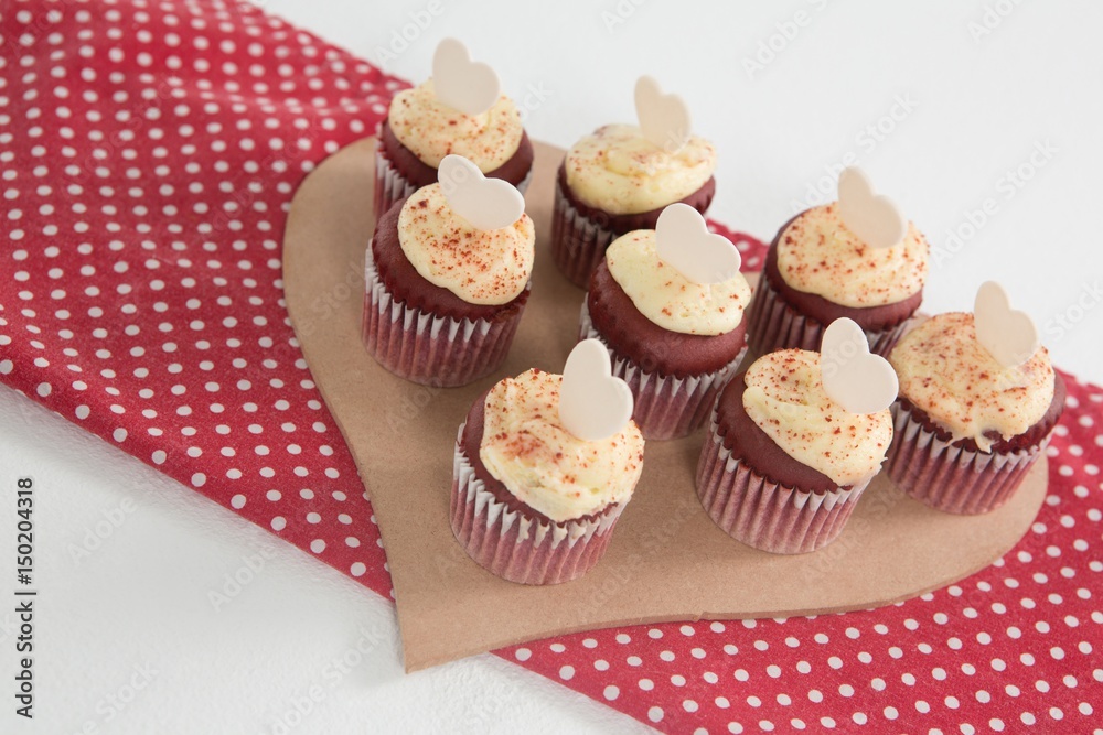 Cup cakes on heart shape paper Cup cakes on heart shape paper