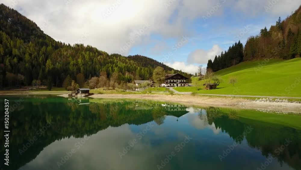 Aerial: flying over Hintersteiner Mountain lake with clear water in Austria and beautiful cloud reflections Aerial: flying over Hintersteiner Mountain lake with clear water in Austria and beautiful cloud reflections