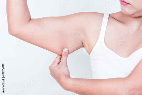 Wallpaper Mural asian woman checking her upper arm Torontodigital.ca