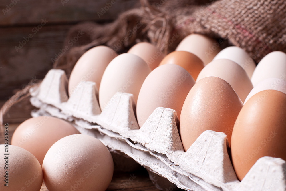 Eggs in the tray on the table Eggs in the tray on the table