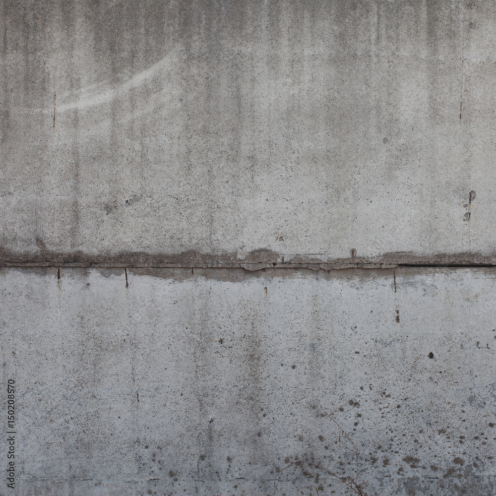 Fototapeta premium Joint of two worn concrete slabs