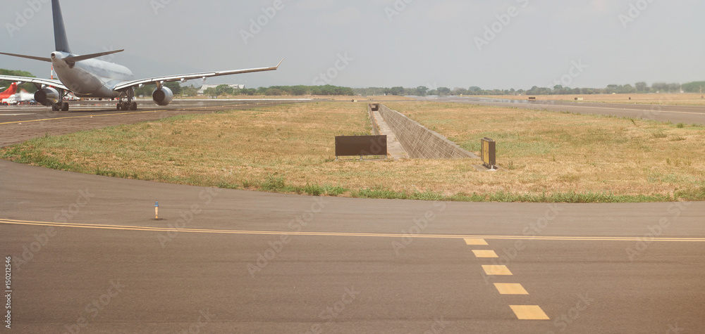 Fototapeta premium Airplane in airport runway