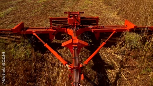 Tractor with a implement in a field